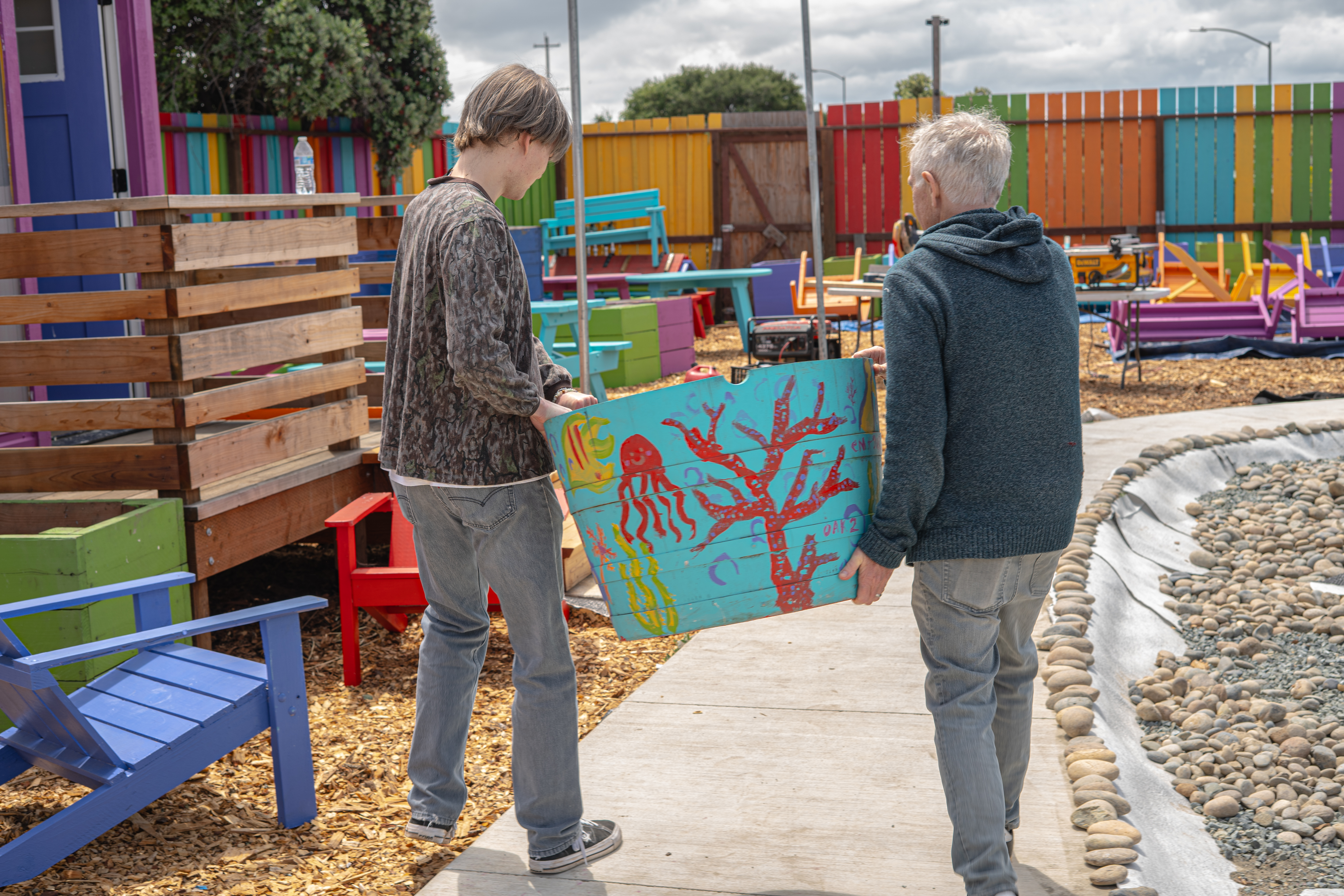 Volunteer painting mural